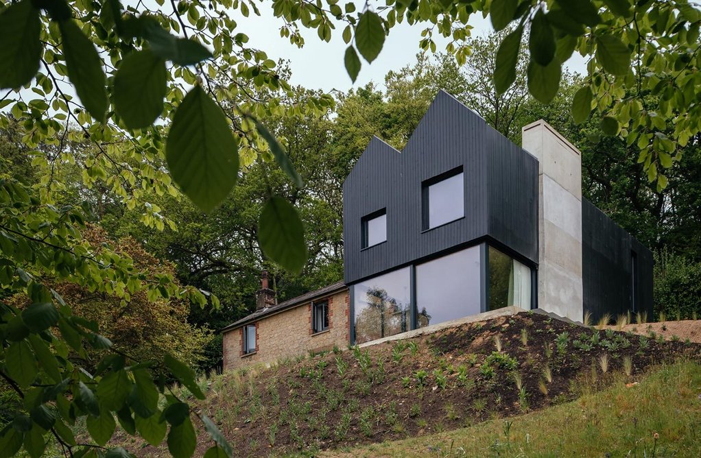 the-concrete-chimney-is-an-important-part-of-the-structure-of-the-extension